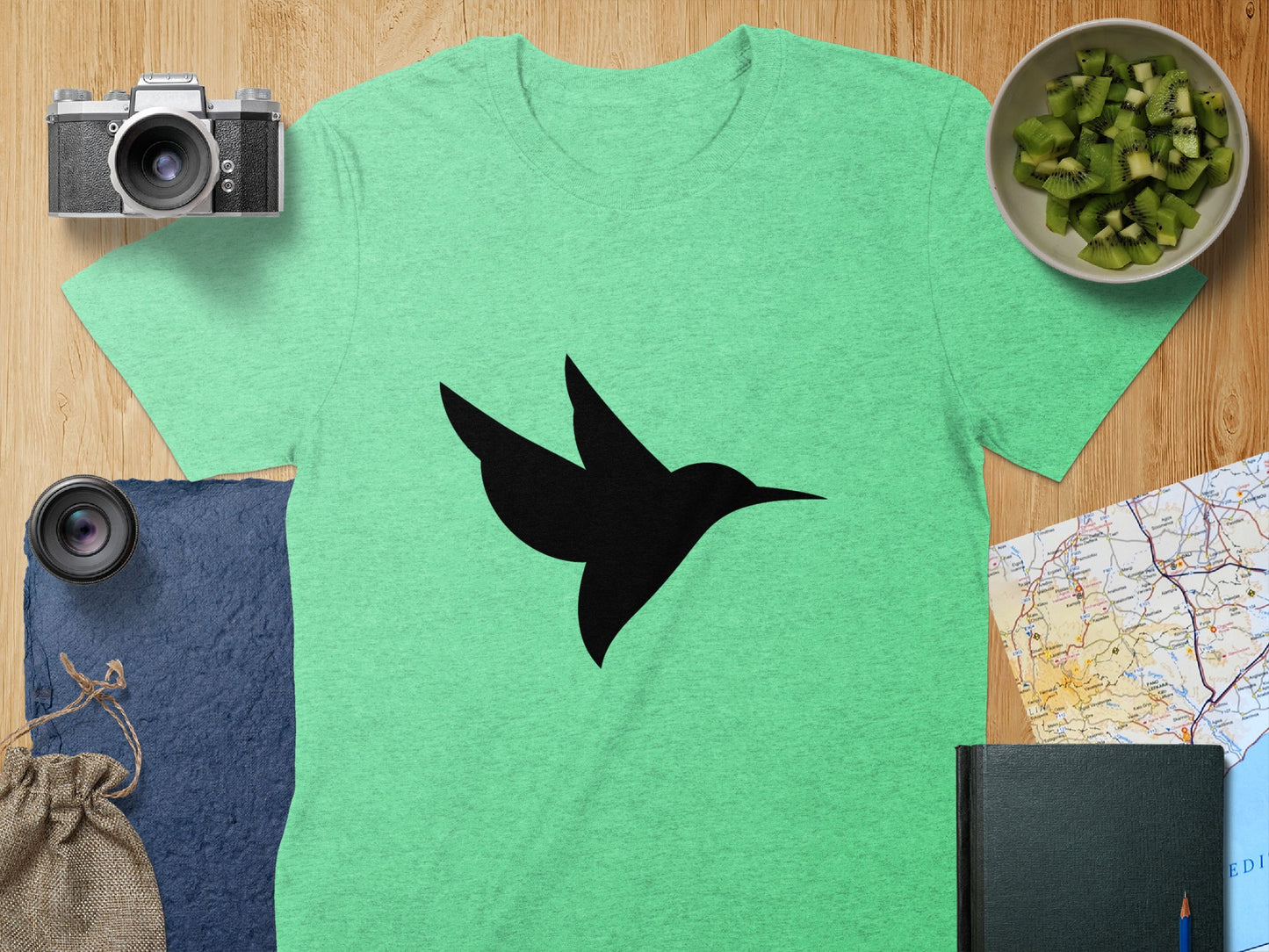 Vibrant Green Tee with Stylish Black Hummingbird Design